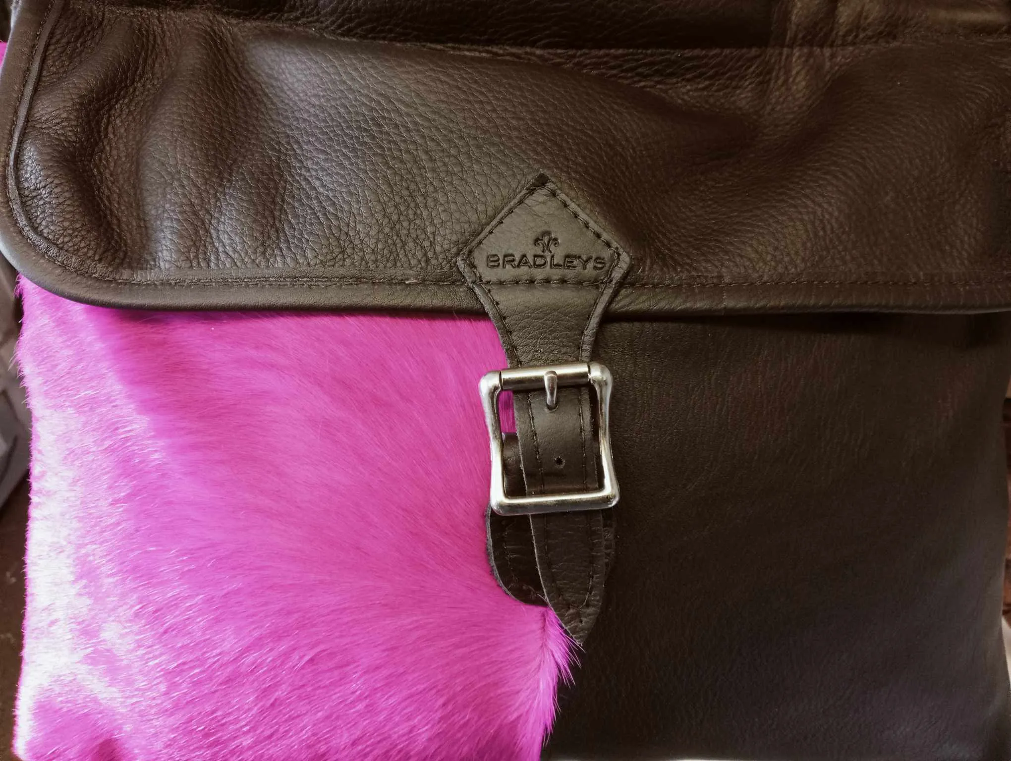 Pink Hair on Black Leather Keepers Bag